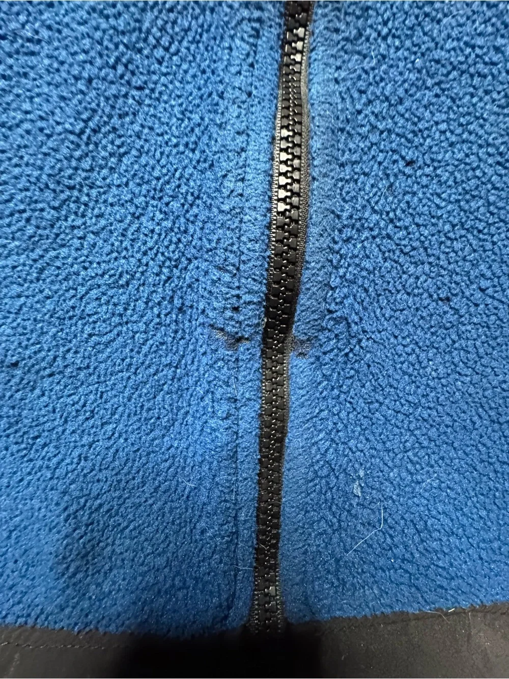 The North Face blue and black polyester fleece jacket in size M 1260